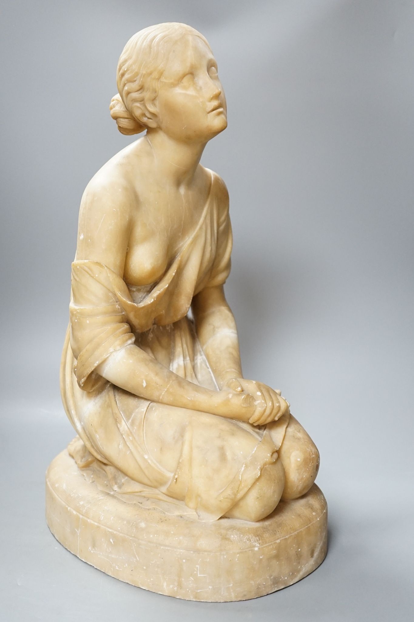 A Victorian alabaster figure kneeling female, 51cm